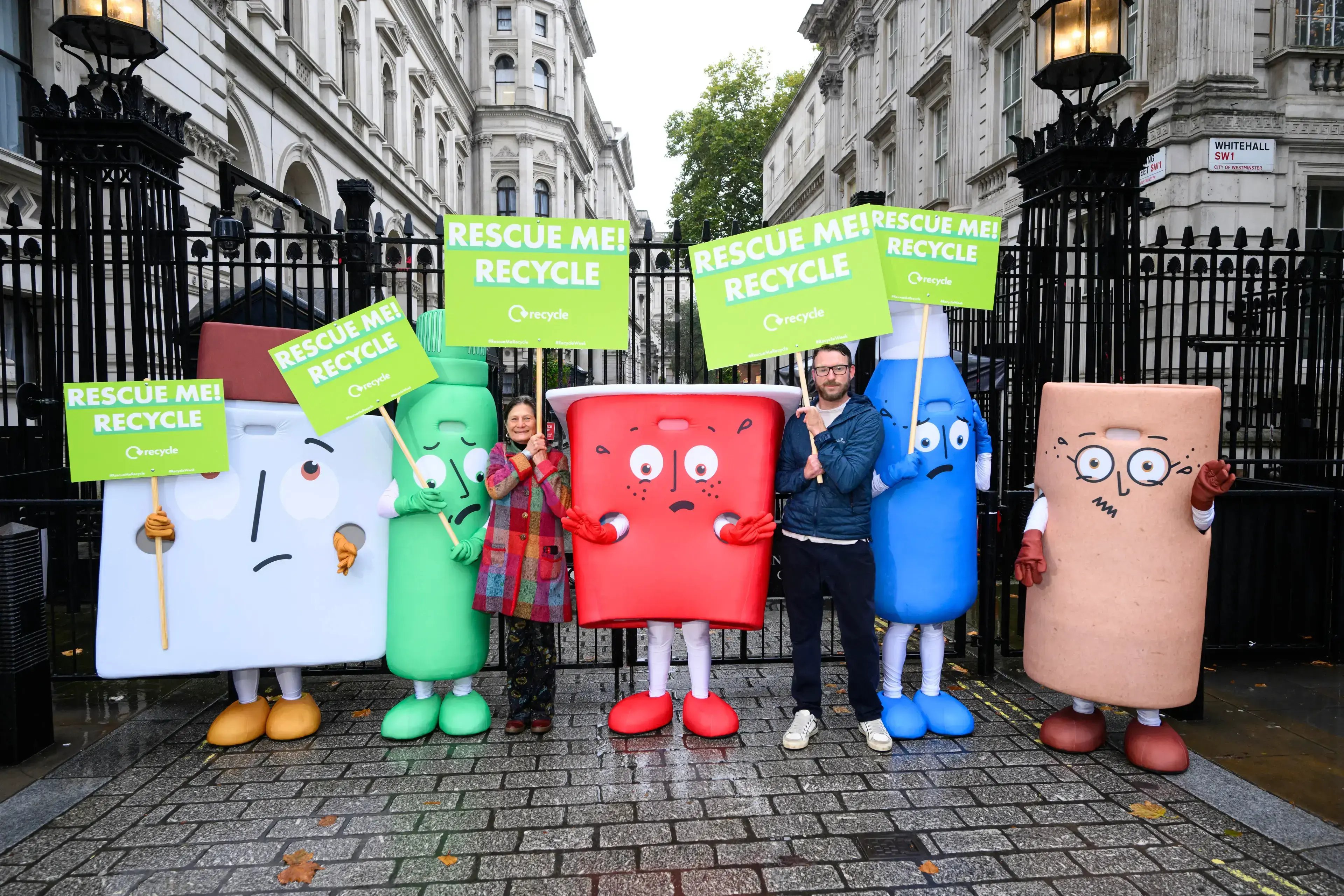 Waste mascots and WRAP CEO Harriet Lamb with JJ Chalmers outside 10 Downing Street for Recycle Week 2024's Rescue Me campaign